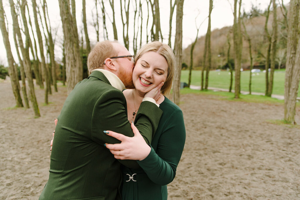 wedding couple embrace at Golden Gardens