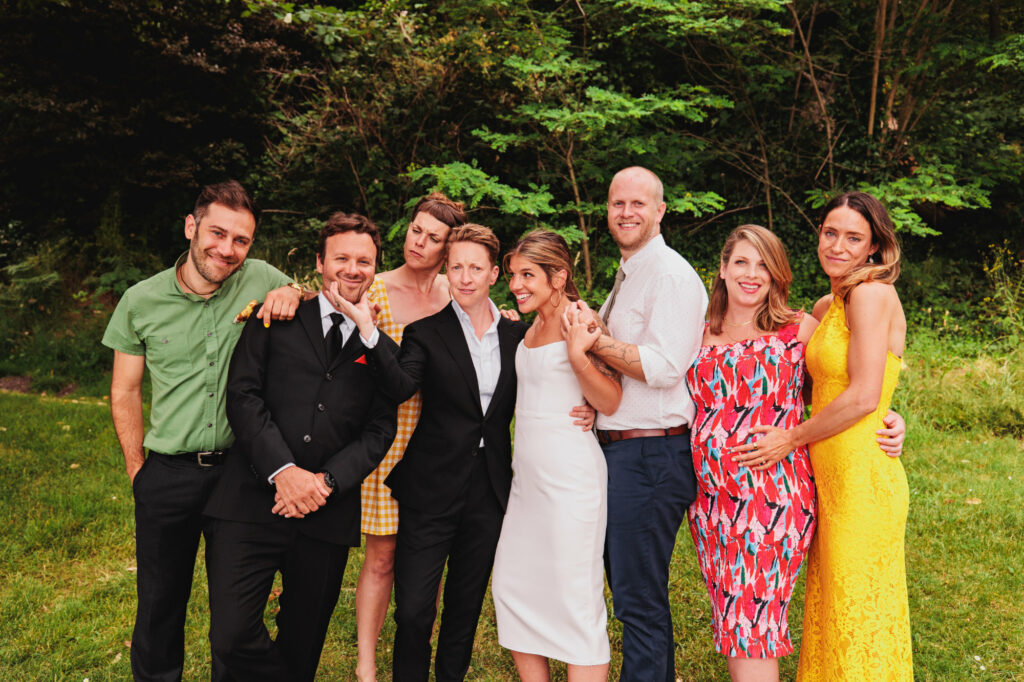 two brides with wedding party in Lincoln Park Seattle