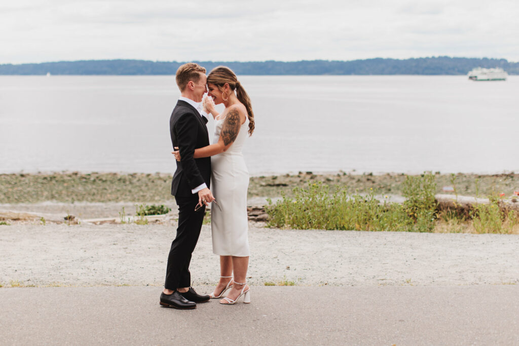 two brides embrace at Puget Sound