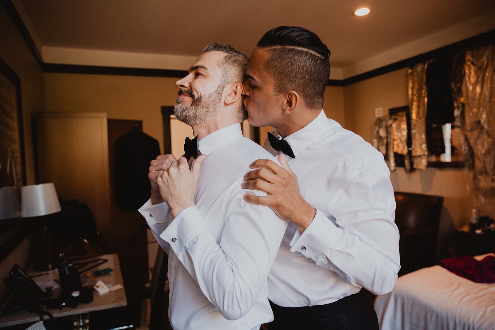 two grooms get ready together for wedding