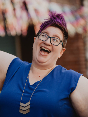 Cindy Savage, past theater stage manager and wedding planner, making a funny face with a smile