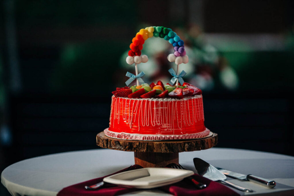 rainbow wedding cake with strawberries