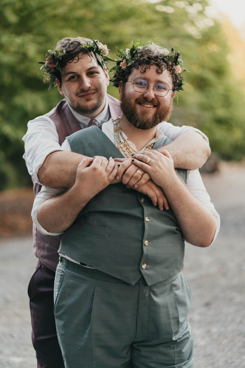 grooms standing and hugging each other