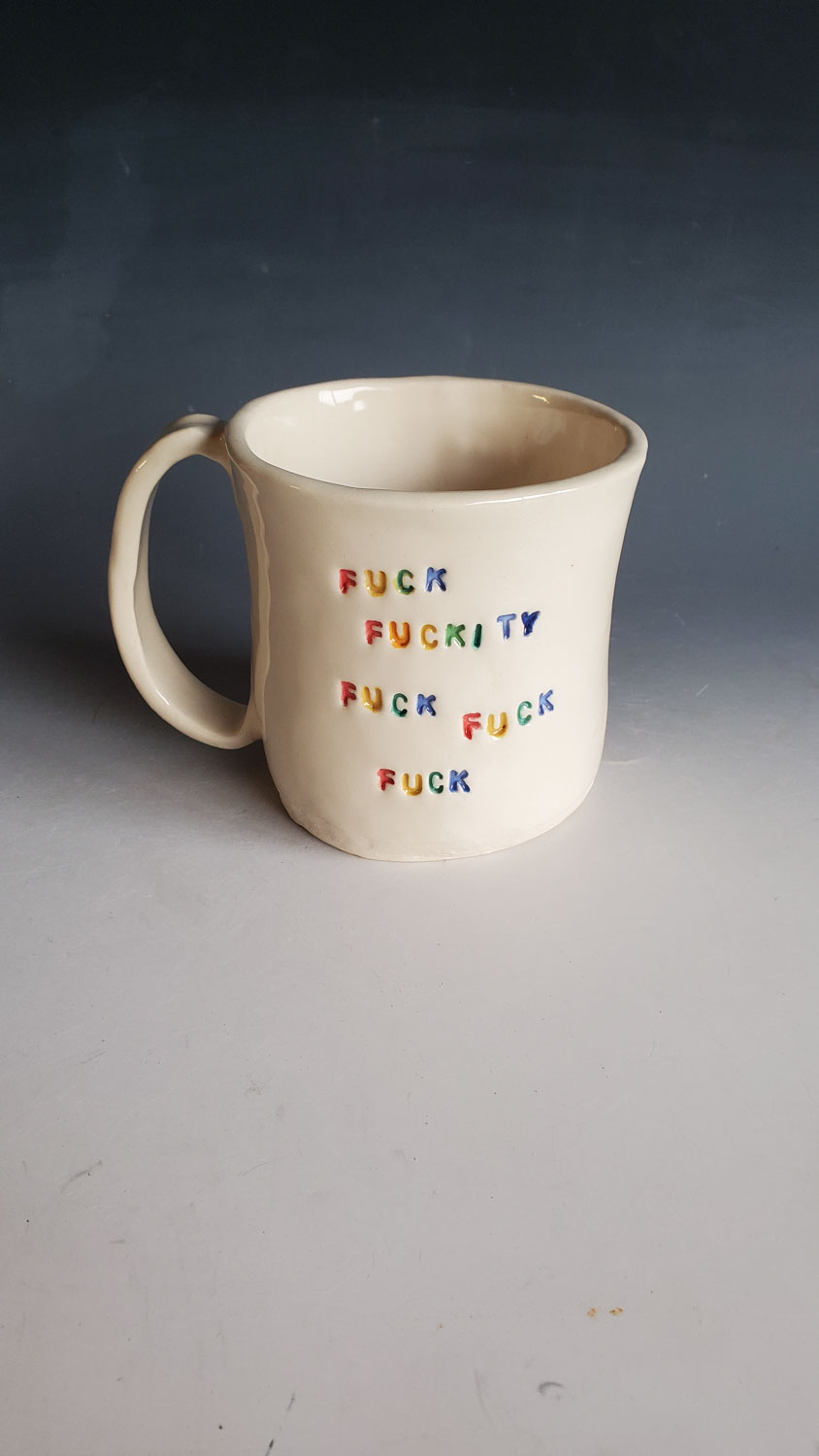 fuck fuckity fuck fuck fuck homemade pottery mug with rainbow text