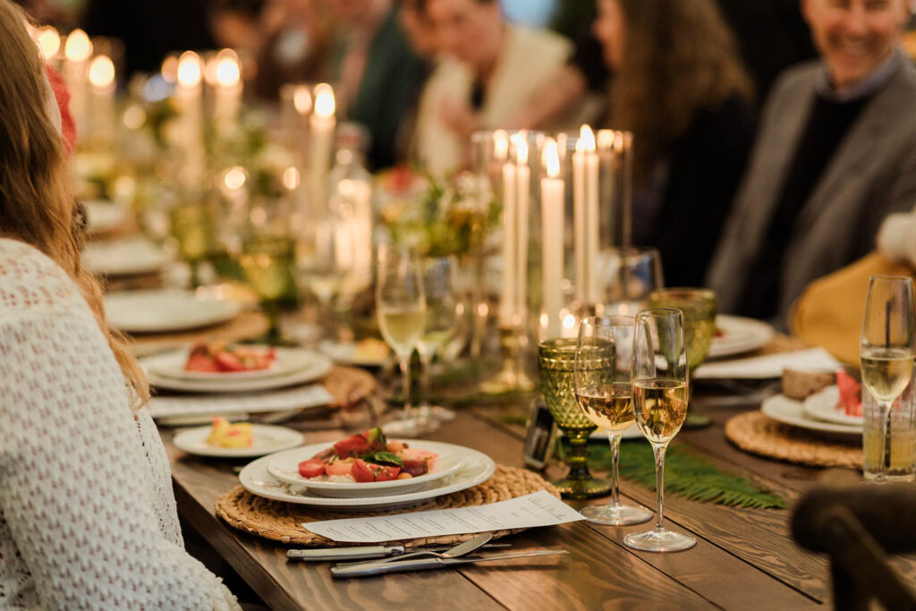 cozy green wedding tablescape layout at queer wedding