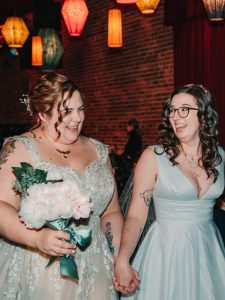 two brides walk down the aisle at Georgetown Ballroom wedding