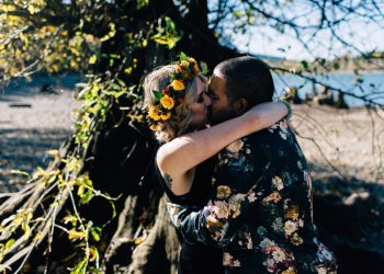 couple embrace and kiss at elopement ceremony