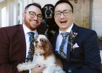 Two grooms with their dogs at Seattle backyard wedding