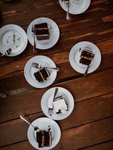 pieces of wedding cake sitting on plates on table