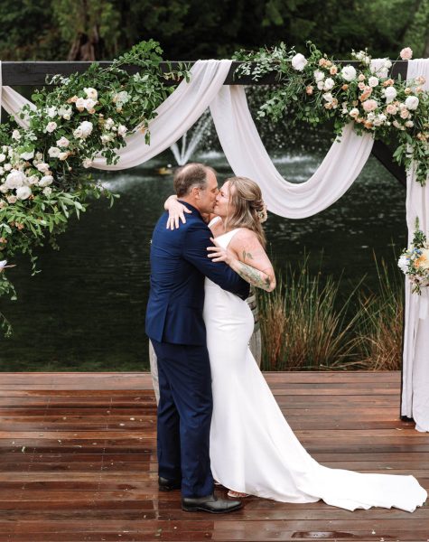 bride and groom kissing at the end of their ceremony in Seattle