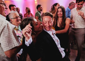 Jackie and Tracey dancing with guests at their wedding